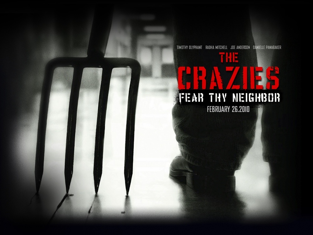 Poster for The Crazies: a pitchfork held by a shadowy figure beneath "Fear thy neighbor"