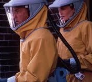 Still from Outbreak: two people in yellow hazmat suits and hoods
