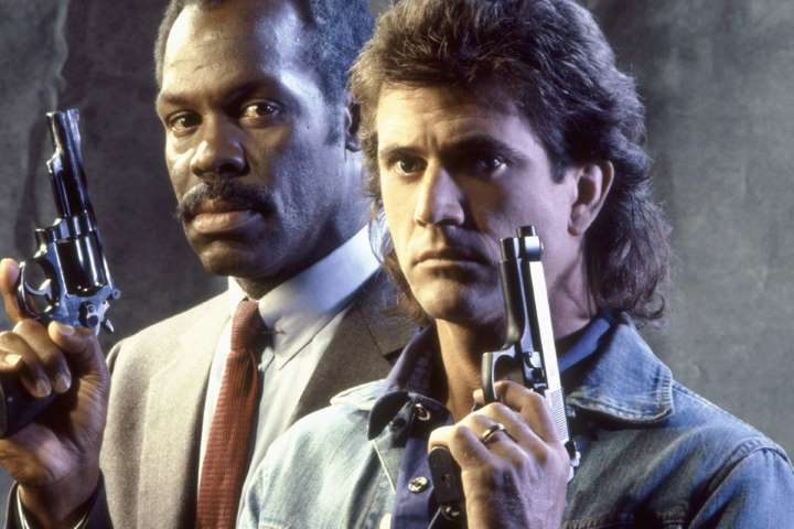 Lethal Weapon promo still: Murtaugh and Riggs each hold up a handgun