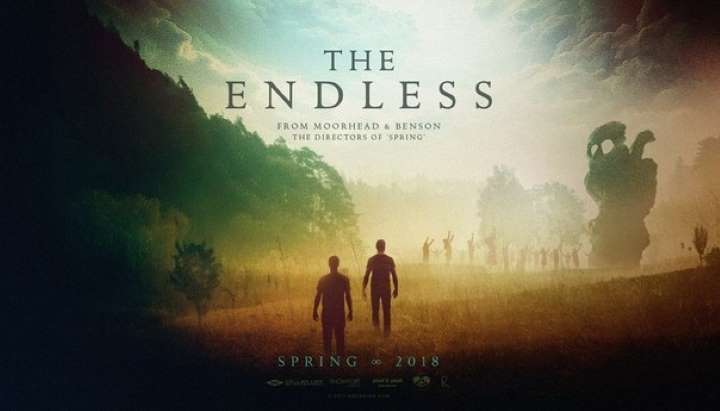 Banner for The Endless: two figures walk toward a misty forest with a looming shape