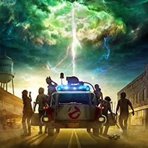Poster for Ghostbusters: Afterlife: the Ecto-1 on a small-town street under a stormy green sky
