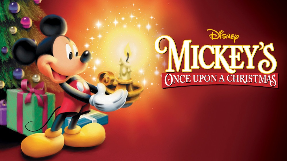Title art for Mickey's Once Upon A Christmas: Mickey Mouse holds a candle beside a Christmas tree