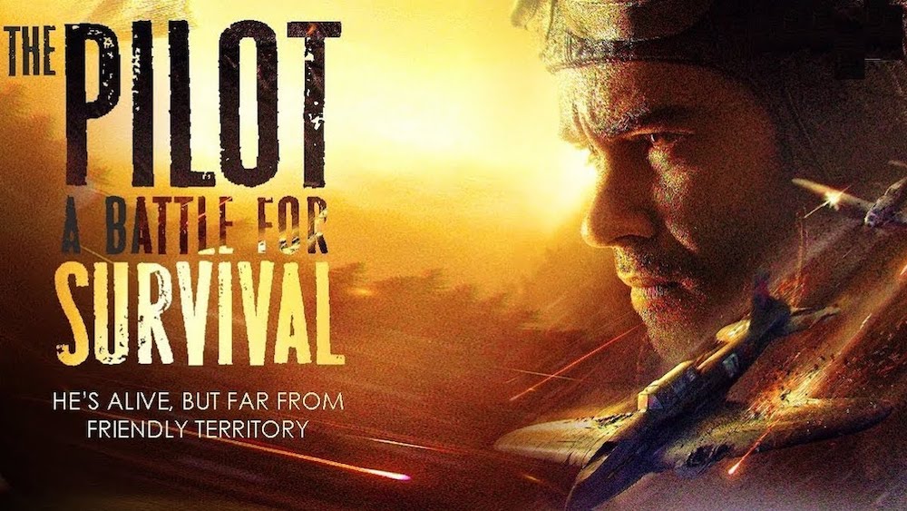 Poster for The Pilot: A Battle for Survival: a wounded pilot's face beside fighter planes against a fiery sky