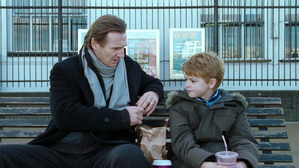 Liam Neeson with Thomas Brodie-Sangster in Love Actually (2003)