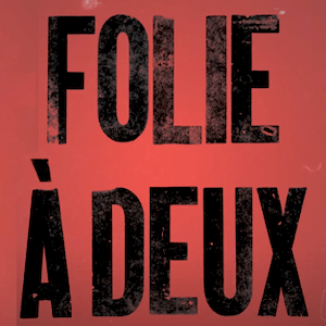 Title art for Joker: Folie à Deux in distressed black lettering on red