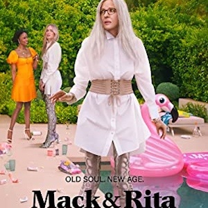 Poster for Mack & Rita: Diane Keaton in a white shirt and boots at a poolside party