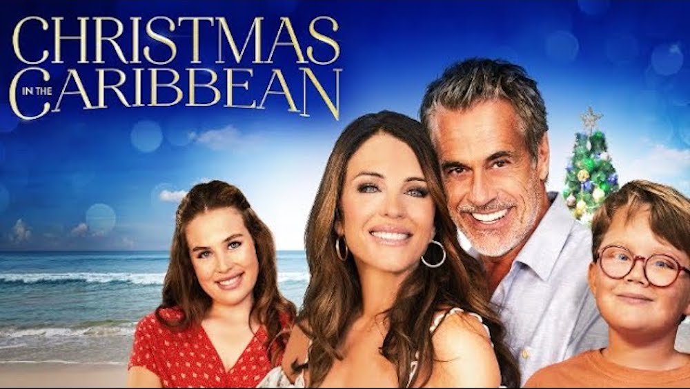 Poster for Christmas in the Caribbean: a smiling family on a beach with a Christmas tree