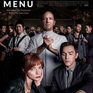 Poster for The Menu: a chef with his hands pressed together stands above a seated couple and staff