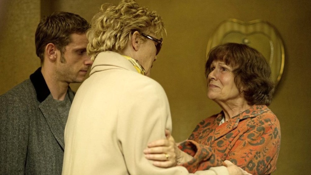 Still from Film Stars Don't Die in Liverpool: Julie Walters embraces Annette Bening as Jamie Bell looks on