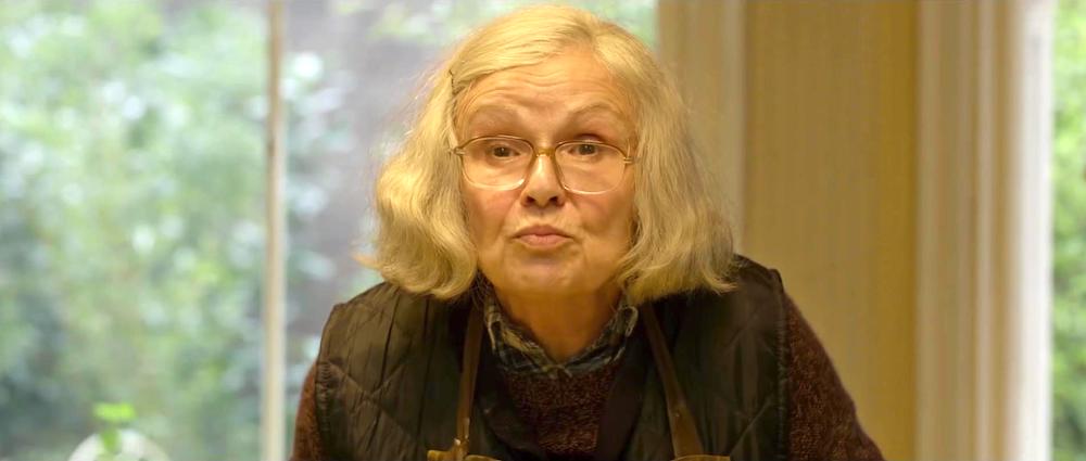 Still from Paddington 2: Julie Walters as Mrs Bird, in glasses and an apron