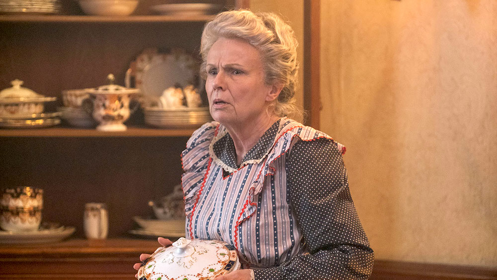 Julie Walters as a startled housekeeper holding a china tureen in Mary Poppins Returns (2018)