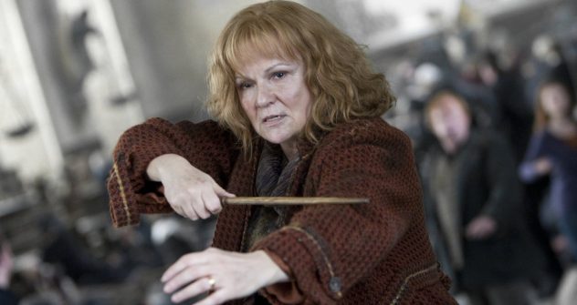 Julie Walters as Molly Weasley aiming her wand in a Harry Potter battle scene