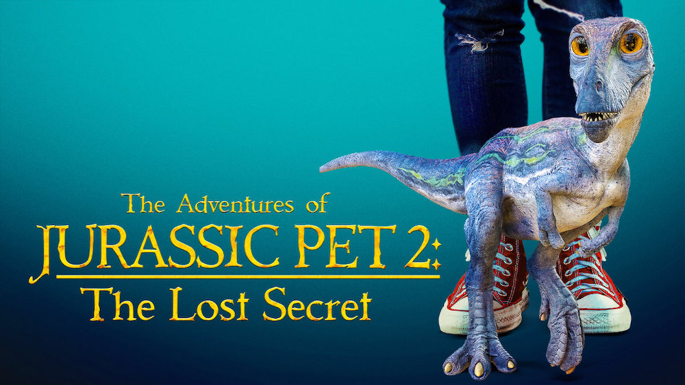 Banner for The Adventures of Jurassic Pet 2: The Lost Secret: a small blue dinosaur stands by a kid's sneakers