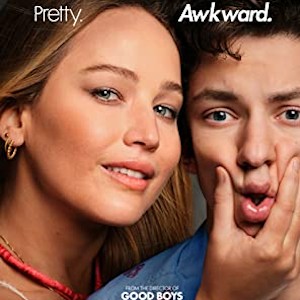 Poster for No Hard Feelings: a smiling woman squeezes an awkward young man's cheeks, "Pretty. Awkward."