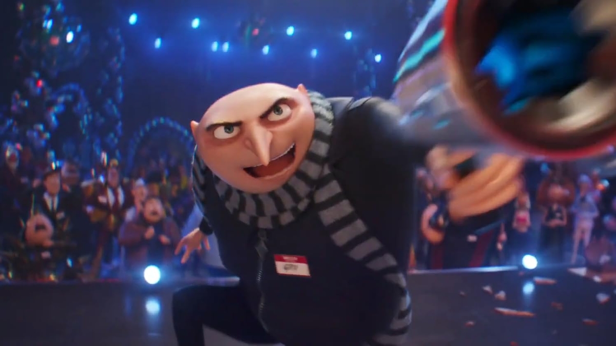 Still from Despicable Me 4: Gru in his striped scarf lunges forward at a festive party