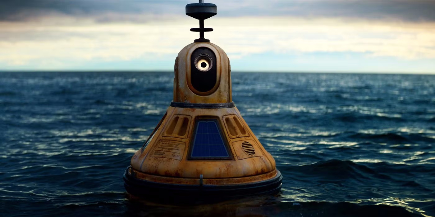 Still from Love Me: a weathered, rusty buoy with a single glowing eye floating on a grey sea