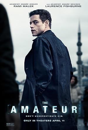 Poster for The Amateur: Rami Malek in a dark coat glances back, a minaret behind him